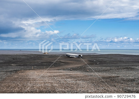 Scenic view of abandoned airplane wreck at black sand beach in Solheimasandur Scenic view of abandoned airplane wreck at black sand beach in Solheimasandur 90729476