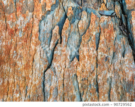 Layered mountain texture. Stone texture. Cross section of rocks. Geological layers. Colored layers of stones in section of the mount, different rock formations and soil layers. Layered mountain texture. Stone texture. Cross section of rocks. Geological layers. Colored layers of stones in section of the mount, different rock formations and soil layers. 90729562