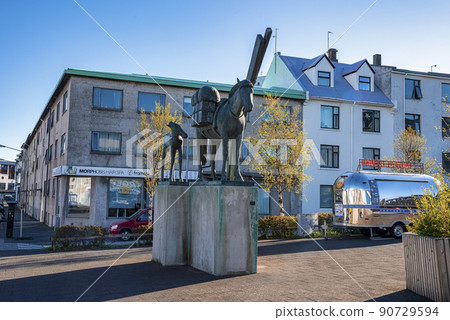 Icelandic Horse statue against buildings in Hlemmur square at Reykjavik city 90729594