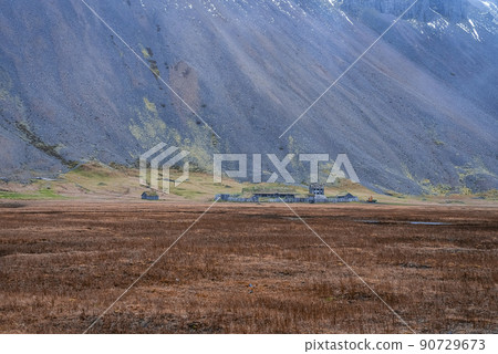 Distant view of Viking village near Stokksnes under Vestrahorn mountain 90729673