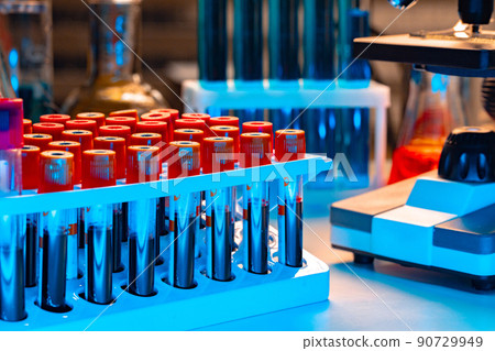 Microscope with blood samples test tubes close up 90729949