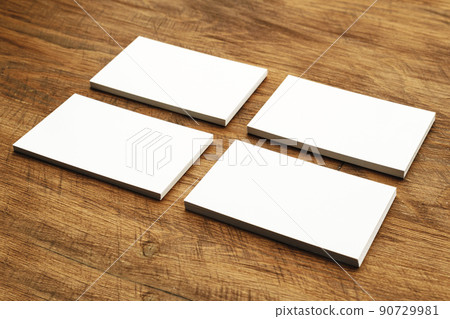 Stacks of businesscards with copy space on wooden background Stacks of businesscards with copy space on wooden background 90729981