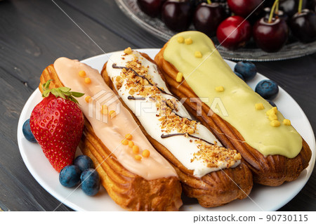 Close up photo of fresh french eclair cake with icing Close up photo of fresh french eclair cake with icing 90730115