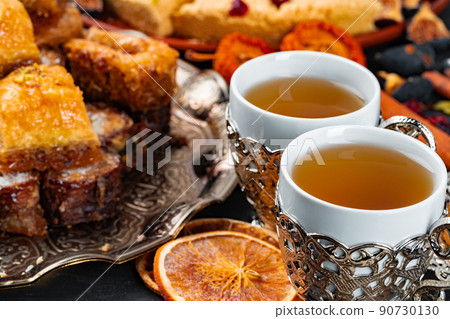 Two cups of coffee with traditional turkish desserts 90730130