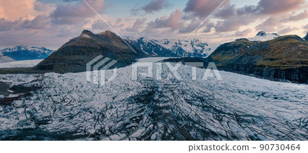 Beautiful glaciers flow through the mountains in Iceland. Beautiful glaciers flow through the mountains in Iceland. 90730464