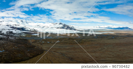 Beautiful glaciers flow through the mountains in Iceland. Beautiful glaciers flow through the mountains in Iceland. 90730482