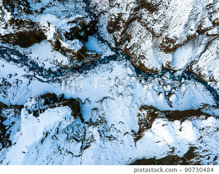 Aerial view of the glaciers and snowy mountains in Iceland. Aerial view of the glaciers and snowy mountains in Iceland. 90730484