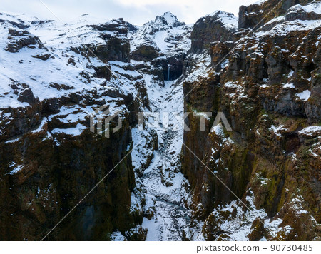 Aerial view of the glaciers and snowy mountains in Iceland. Aerial view of the glaciers and snowy mountains in Iceland. 90730485