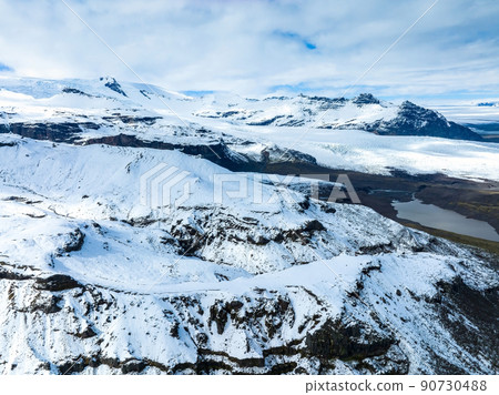 Aerial view of the glaciers and snowy mountains in Iceland. 90730488
