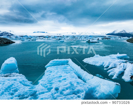 Scenic view of icebergs in Jokulsarlon glacier lagoon, Iceland, at dusk. 90731026