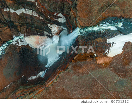 Aerial view on Hengifoss waterfall with red stripes sediments in Iceland. Aerial view on Hengifoss waterfall with red stripes sediments in Iceland. 90731212