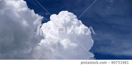 Bright landscape of white puffy cumulus clouds on blue clear sky 90731981
