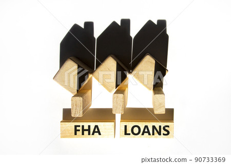 FHA federal housing administration loans symbol. Concept words 'FHA federal housing administration loans' on wooden blocks on a beautiful white background. Business and FHA loans concept. Copy space. FHA federal housing administration loans symbol. Concept words 'FHA federal housing administration loans' on wooden blocks on a beautiful white background. Business and FHA loans concept. Copy space. 90733369