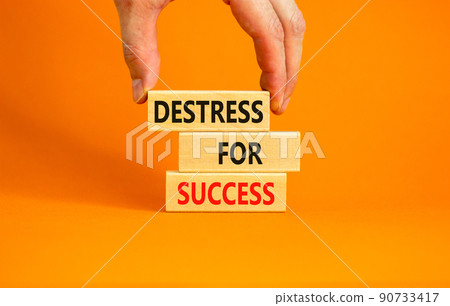 Destress for success symbol. Concept words Destress for success on wooden blocks. Doctor hand. Beautiful orange background. Psychological business and destress for success concept. Copy space. 90733417