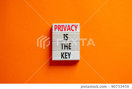Privacy is the key symbol. Concept words Privacy is the key on wooden blocks on a beautiful orange table orange background. Business, finacial and privacy is the key concept. 90733439