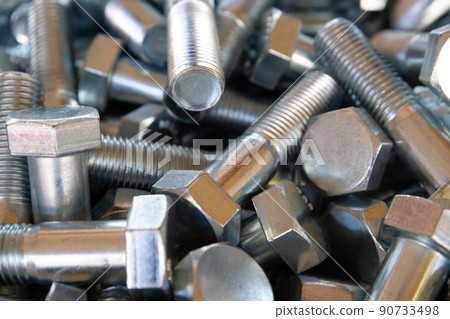 Close up of metall bolts background. Industrial abstract concept 90733498