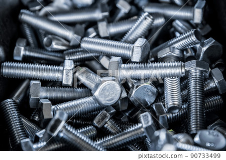 Close up of metall bolts background. Industrial abstract concept Close up of metall bolts background. Industrial abstract concept 90733499
