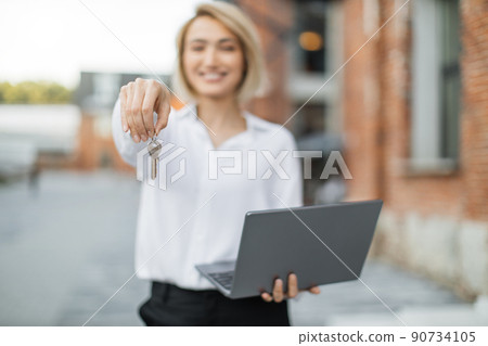 Focus on woman hand with keys. Focus on woman hand with keys. 90734105