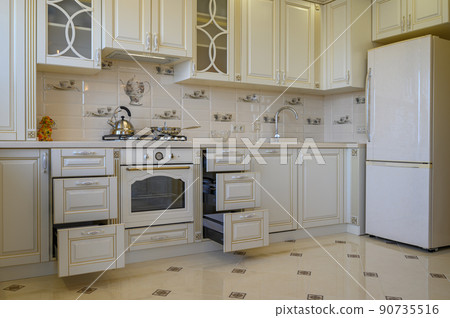 Classic white and beige kitchen furniture in studio apartment 90735516
