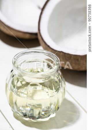 Endosperm and coconut oil visible from cracked coconut Endosperm and coconut oil visible from cracked coconut 90738366