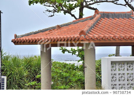 Red tile roof and sea Red tile roof and sea 90738734