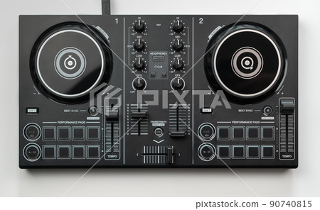 DJ mixing deck Controller connecting to Laptop and tablet using USB cable top view, isolated on white. DJ mixing deck Controller connecting to Laptop and tablet using USB cable top view, isolated on white. 90740815