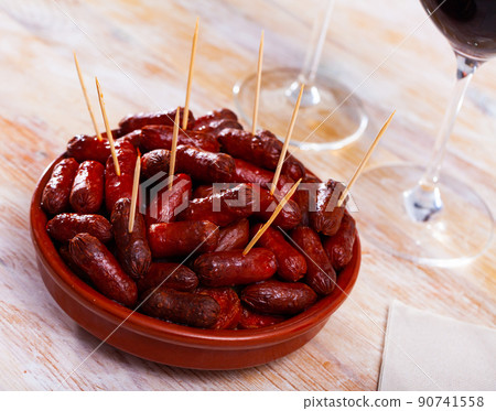 Spanish appetizer, warm mini chorizo sausages Spanish appetizer, warm mini chorizo sausages 90741558