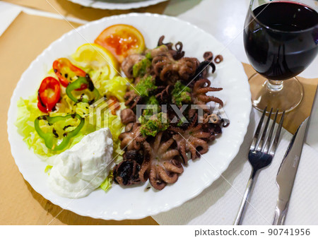 Baby octopus with salad Baby octopus with salad 90741956