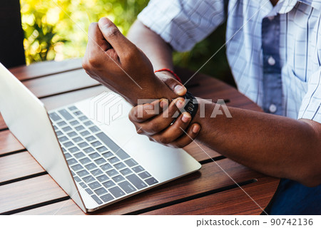 black man holding his wrist pain black man holding his wrist pain 90742136