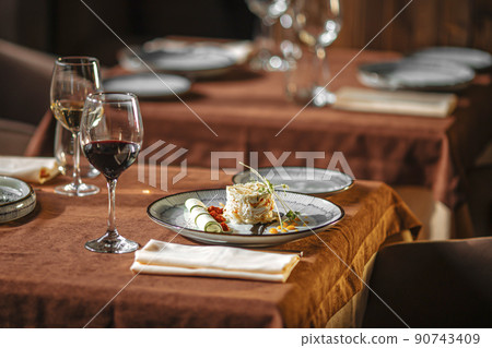 Served restaurant table with drinks and food Served restaurant table with drinks and food 90743409