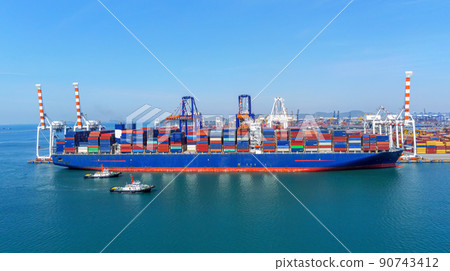 Arial view by drone camera transportation logistics and container dock cargo yard with working crane bridge in shipyard with transport logistic import export with blue sky background. Arial view by drone camera transportation logistics and container dock cargo yard with working crane bridge in shipyard with transport logistic import export with blue sky background. 90743412