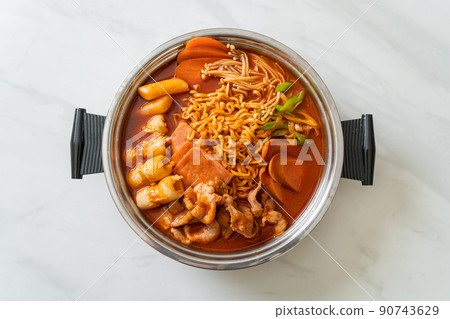 Budae Jjigae or Budaejjigae (Army stew or Army base stew). It is loaded with Kimchi, spam, sausages, ramen noodles and much more Budae Jjigae or Budaejjigae (Army stew or Army base stew). It is loaded with Kimchi, spam, sausages, ramen noodles and much more 90743629
