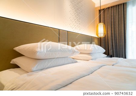 white pillow decoration on bed 90743632