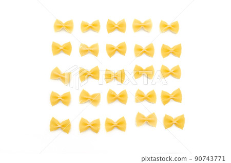 Dry uncooked farfalle pasta on white background Dry uncooked farfalle pasta on white background 90743771