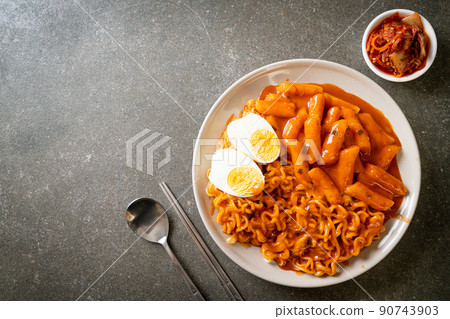 Rabokki (Ramen or Korean instant noodle and Tteokbokki) in spicy korean sauce Rabokki (Ramen or Korean instant noodle and Tteokbokki) in spicy korean sauce 90743903