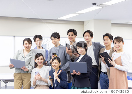 Men and women with gadgets 90743980