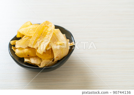 Banana Chips - fried or baked sliced banana 90744136