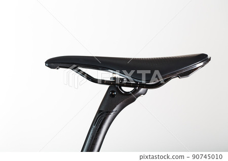 Bicycle saddle on a light background accessories for bike repair and tuning Bicycle saddle on a light background accessories for bike repair and tuning 90745010
