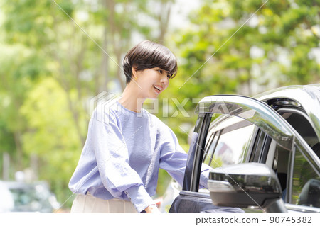 A woman driving a car A woman driving a car 90745382