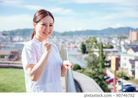 Female medical worker in a white coat (nurse, guts pose) Female medical worker in a white coat (nurse, guts pose) 90746782