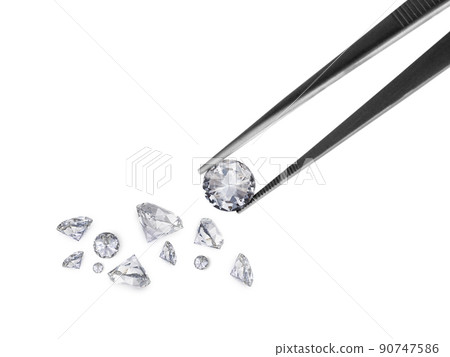 brilliant cut diamond held by tweezers brilliant cut diamond held by tweezers 90747586