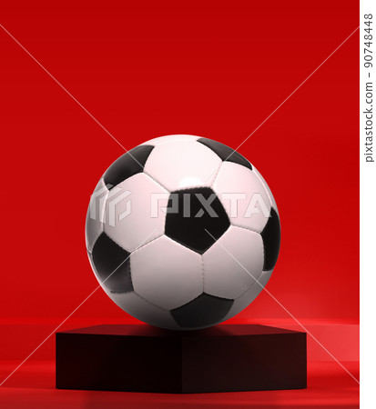 Soccer ball on black pentagon podium in the red studio Soccer ball on black pentagon podium in the red studio 90748448