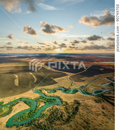 Summer scenery aerial view of winding river in beautiful valley at sunset Summer scenery aerial view of winding river in beautiful valley at sunset 90749708