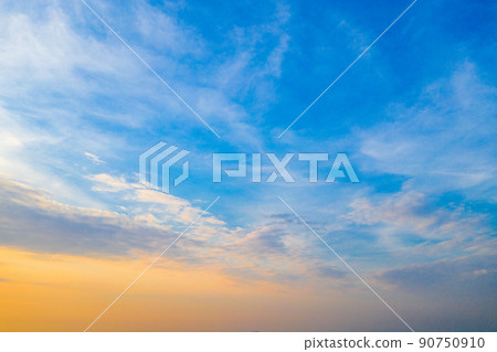 Blue orange and yellow sky with the cloud in twilight time at Thailand in year 2018. 90750910