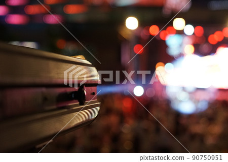 Sportlighter shoots light, laser beam to the concert stage. 90750951