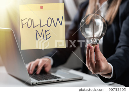Hand writing sign Follow Me. Word Written on Inviting a person or group to obey your prefered leadership Businessman in suit holding notepad symbolizing successful teamwork. 90753305