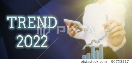 Text caption presenting Trend 2022. Business concept things that is famous for short period of time in current year Businessman in suit holding tablet symbolizing successful teamwork. Text caption presenting Trend 2022. Business concept things that is famous for short period of time in current year Businessman in suit holding tablet symbolizing successful teamwork. 90753317