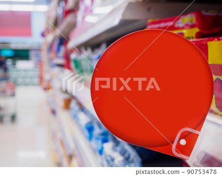 red discount sign display on supermarket shelves 90753478