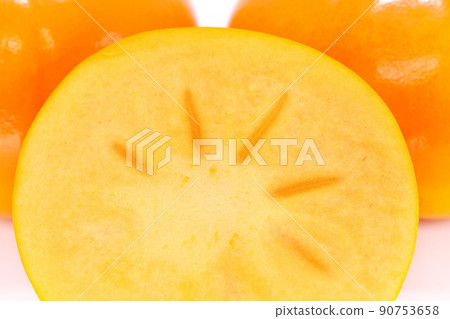 Persimmon seedless sweet persimmon cut cross section bright background Persimmon seedless sweet persimmon cut cross section bright background 90753658