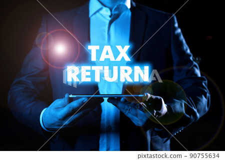 Text caption presenting Tax Return. Business concept which taxpayer makes annual statement of income circumstances Businessman in suit holding notepad symbolizing successful teamwork. Text caption presenting Tax Return. Business concept which taxpayer makes annual statement of income circumstances Businessman in suit holding notepad symbolizing successful teamwork. 90755634